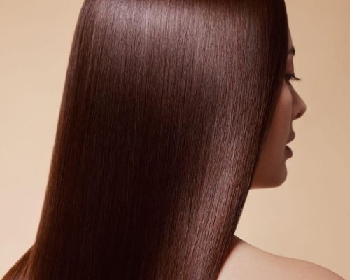 Capture the transformation at Escape Salon with a radiant image of a woman flaunting her flawlessly smooth and frizz-free hair post-keratin treatment. The skilled stylists at Escape Salon deliver stunning results, showcasing the effectiveness of their professional services for long-lasting, healthy, and beautifully straight hair.